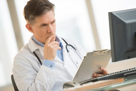 Doctor looking at tablet
